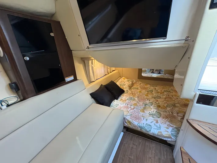 Wining Down Yacht Photos Pics Interior of 2016 Regal 35 Sport Coupe with cozy bed and modern furnishings.