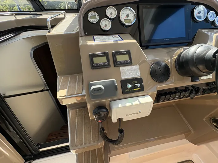 Wining Down Yacht Photos Pics Control panel of a 2016 Regal 35 Sport Coupe with Garmin navigation system.