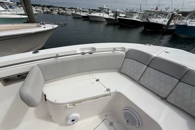  Yacht Photos Pics 2021 Sea Fox 288 Commander boat interior with cushioned seating at marina.