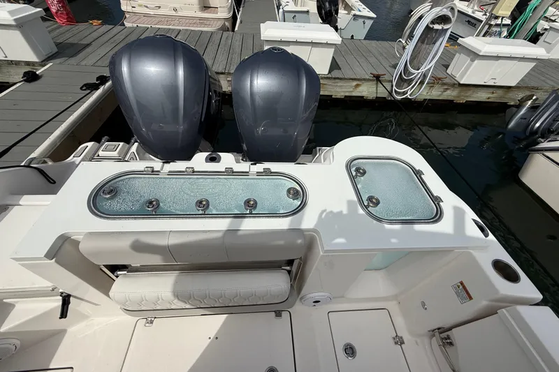  Yacht Photos Pics 2021 Sea Fox 288 Commander boat with dual engines and live wells at a marina dock.