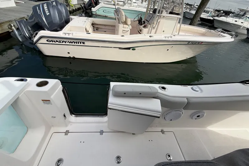  Yacht Photos Pics 2021 Sea Fox 288 Commander docked near Grady-White boat in marina.