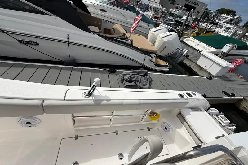  Yacht Photos Pics 2021 Sea Fox 288 Commander docked alongside other boats at a marina.