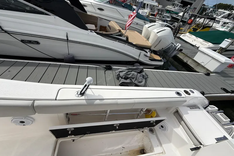  Yacht Photos Pics 2021 Sea Fox 288 Commander docked, featuring spacious deck and modern design.