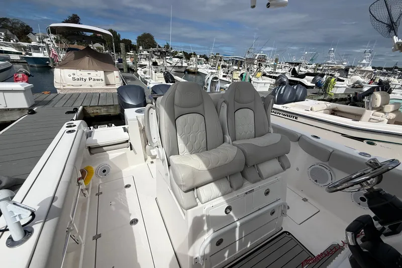  Yacht Photos Pics 2021 Sea Fox 288 Commander boat interior with plush seating at a marina.