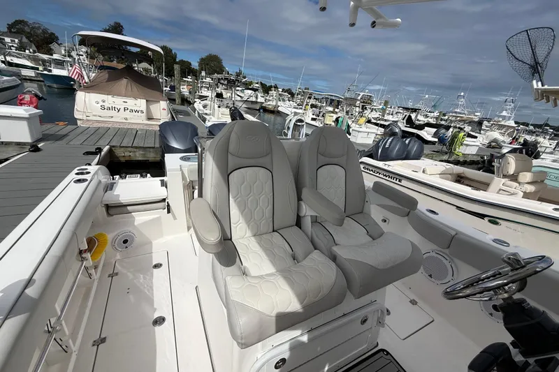  Yacht Photos Pics 2021 Sea Fox 288 Commander boat interior with dual captain's chairs at marina.