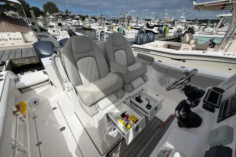  Yacht Photos Pics 2021 Sea Fox 288 Commander boat interior with dual captain's chairs and control panel.