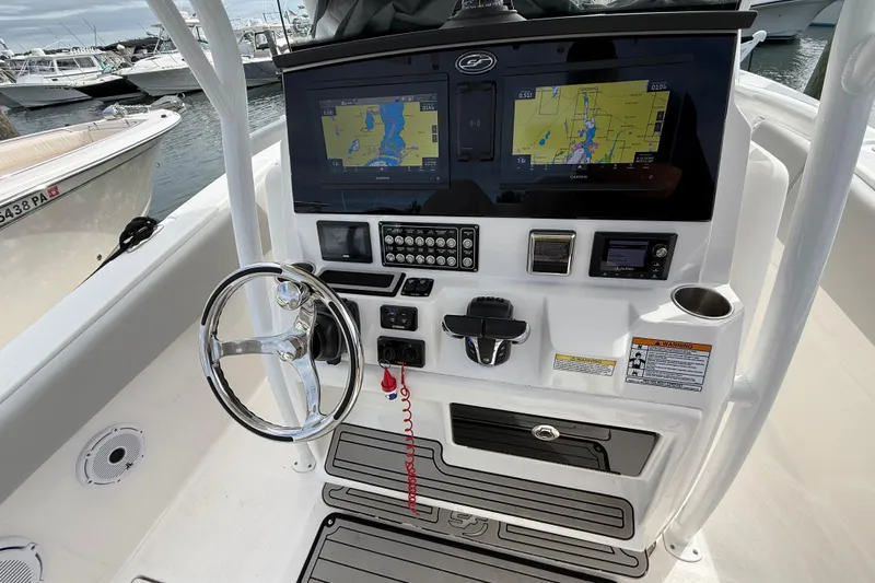  Yacht Photos Pics 2021 Sea Fox 288 Commander boat dashboard with navigation screens and steering wheel.