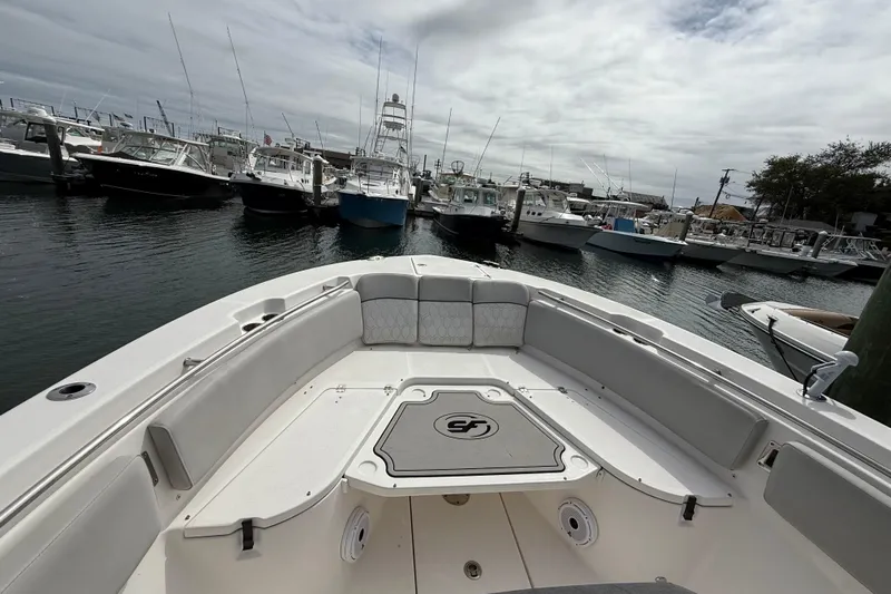  Yacht Photos Pics 2021 Sea Fox 288 Commander boat docked in a marina with other vessels.