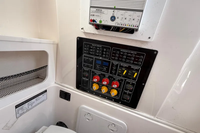  Yacht Photos Pics Control panel of a 2021 Sea Fox 288 Commander boat, featuring various switches and circuit breakers.