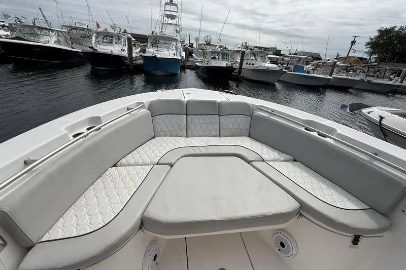  Yacht Photos Pics 2021 Sea Fox 288 Commander boat with spacious seating at a marina.