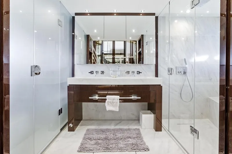 Pura Vida Yacht Photos Pics Luxurious bathroom in 2022 Sunseeker Motoryacht with modern fixtures and elegant design.