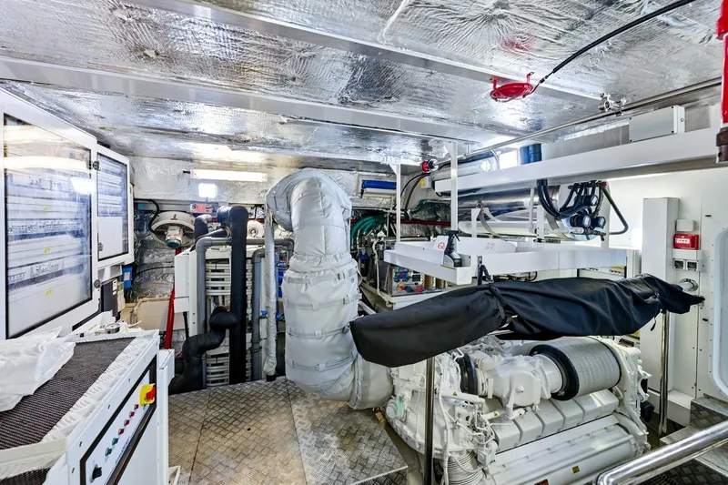 Pura Vida Yacht Photos Pics Engine room of a 2022 Sunseeker Motoryacht, featuring advanced machinery and control panels.