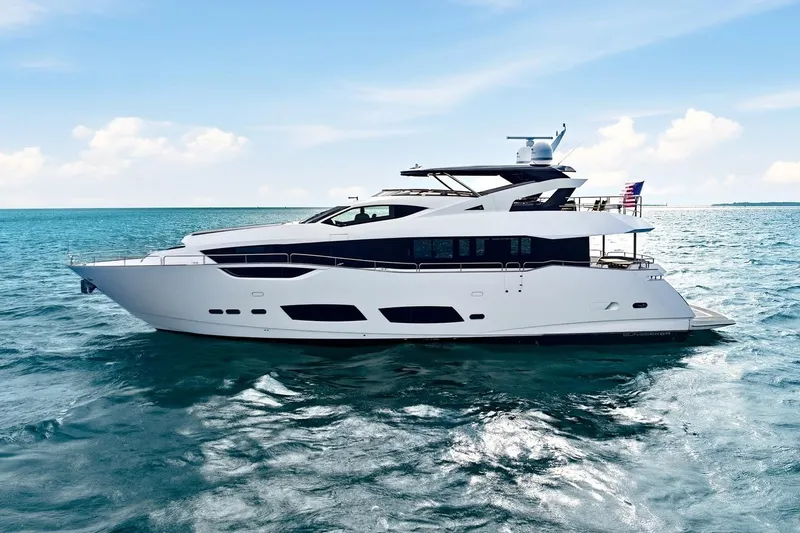 Pura Vida Yacht Photos Pics 2022 Sunseeker Motoryacht cruising on clear blue ocean under a sunny sky.