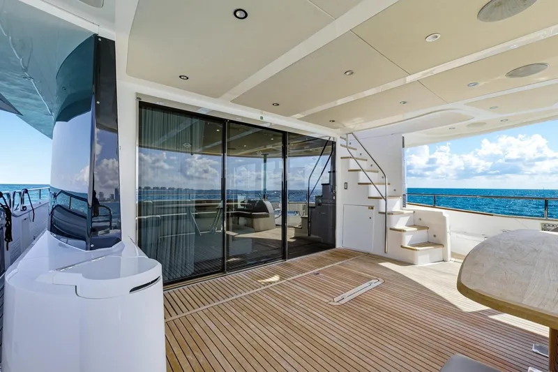 Pura Vida Yacht Photos Pics Luxurious 2022 Sunseeker Motoryacht deck with ocean view, featuring sleek design and modern amenities.
