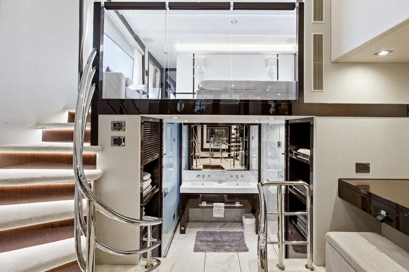 Pura Vida Yacht Photos Pics Luxurious interior of 2022 Sunseeker Motoryacht with modern staircase and elegant bathroom.