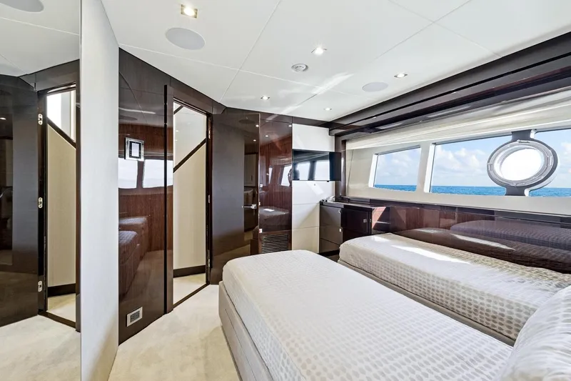 Pura Vida Yacht Photos Pics Luxurious Sunseeker Motoryacht 2022 bedroom with ocean view and modern interior design.