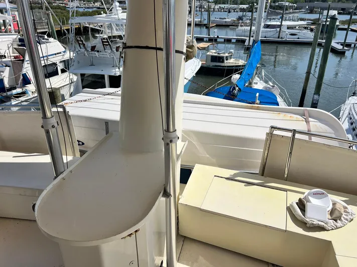 Arvo Arrow Yacht Photos Pics 1985 Chris-Craft 460 Constellation yacht docked in a marina, surrounded by other boats.