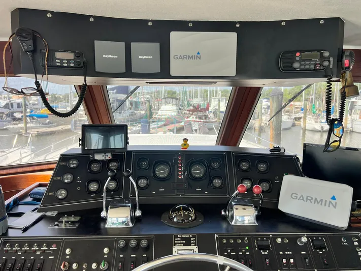 Arvo Arrow Yacht Photos Pics Control panel of a 1985 Chris-Craft 460 Constellation yacht with Garmin navigation systems.