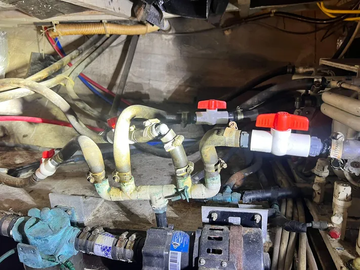 Arvo Arrow Yacht Photos Pics Engine room plumbing of 1985 Chris-Craft 460 Constellation with valves and pipes.