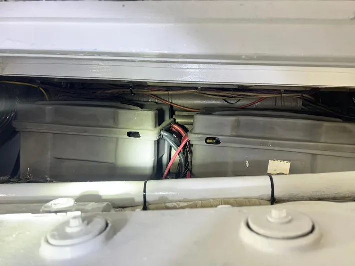 Arvo Arrow Yacht Photos Pics Battery compartment of 1985 Chris-Craft 460 Constellation with visible wiring and connectors.