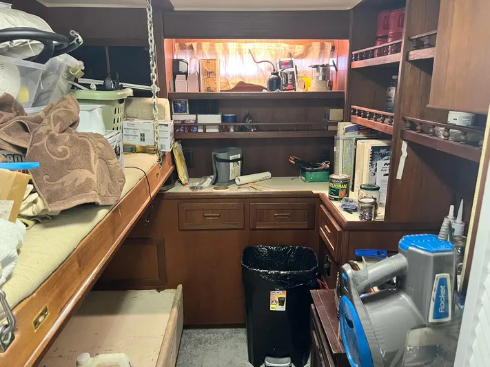 Arvo Arrow Yacht Photos Pics Interior of 1985 Chris-Craft 460 Constellation with storage shelves and work area.