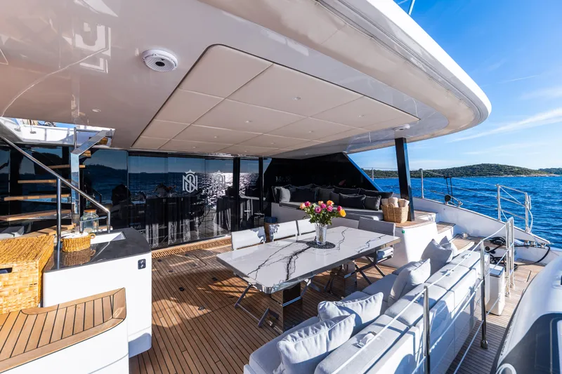 Mr.si Yacht Photos Pics Luxurious Sunreef 60 Sailing yacht deck with elegant seating and ocean view, 2023 model.