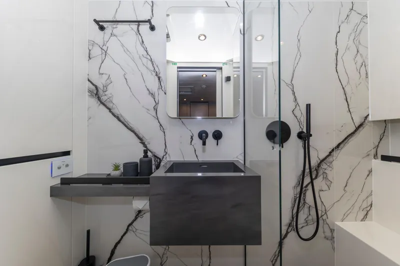 Mr.si Yacht Photos Pics Luxurious bathroom in 2023 Sunreef 60 Sailing yacht with modern fixtures and marble accents.