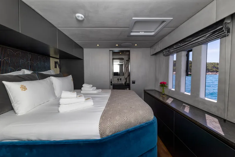 Mr.si Yacht Photos Pics Luxurious bedroom interior of 2023 Sunreef 60 Sailing yacht with ocean view.