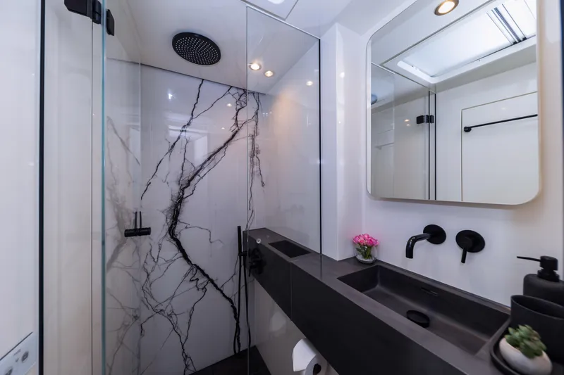 Mr.si Yacht Photos Pics Luxurious bathroom in 2023 Sunreef 60 Sailing yacht with modern fixtures and elegant design.
