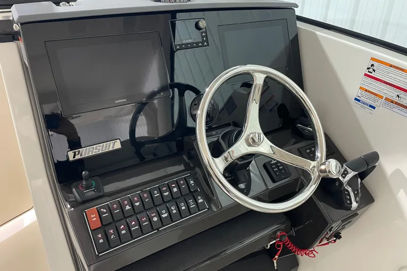  Yacht Photos Pics 2024 Pursuit DC 326 Dual Console helm with steering wheel and control panel.