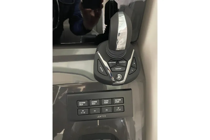  Yacht Photos Pics Control panel of 2024 Pursuit DC 326 Dual Console boat with joystick and buttons.