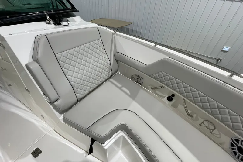  Yacht Photos Pics 2024 Pursuit DC 326 Dual Console boat interior with quilted seating and sleek design.