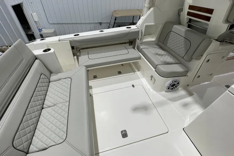  Yacht Photos Pics 2024 Pursuit DC 326 Dual Console boat interior with luxurious seating and modern design.