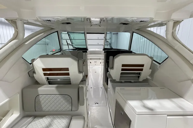  Yacht Photos Pics 2024 Pursuit DC 326 Dual Console interior with modern seating and sleek design.