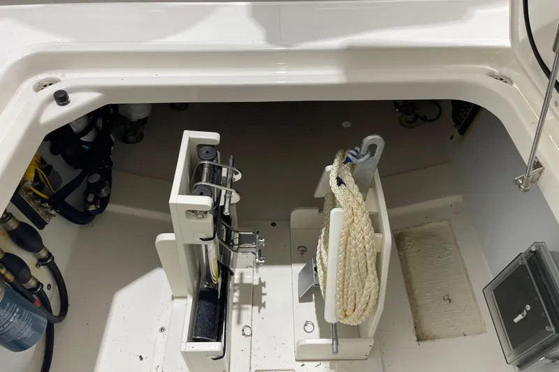  Yacht Photos Pics 2024 Pursuit DC 326 Dual Console storage compartment with rope and equipment.