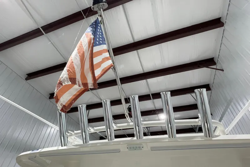  Yacht Photos Pics 2024 Pursuit DC 326 Dual Console with American flag in indoor storage.