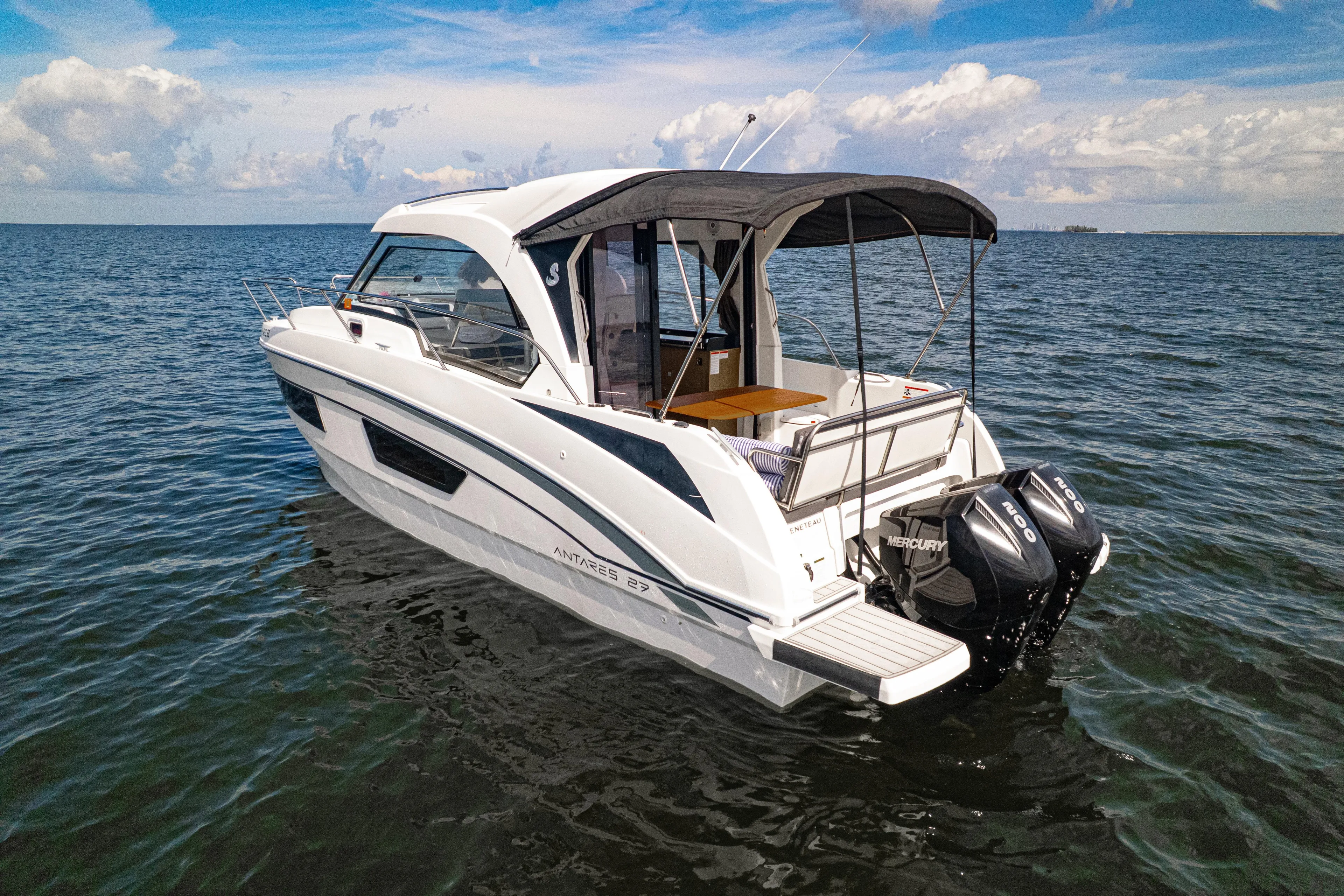  Yacht Photos Pics 2021 Beneteau Antares 9 boat on open water, featuring twin Mercury engines.