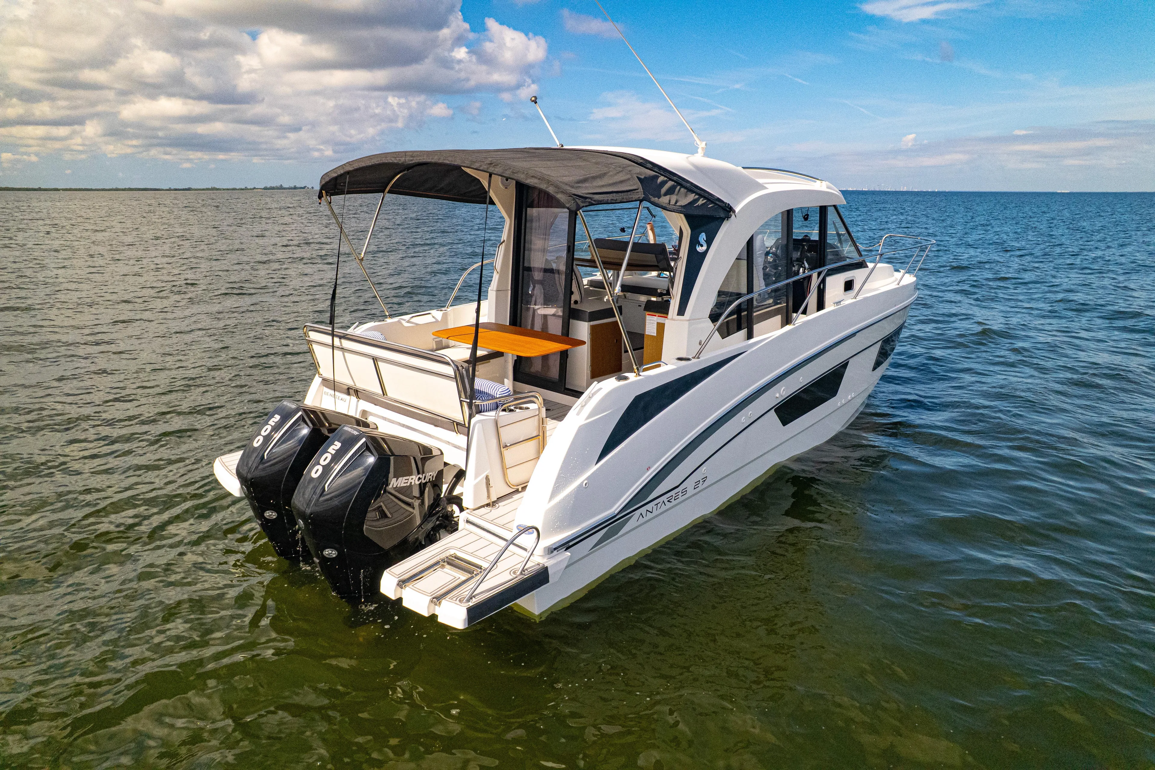  Yacht Photos Pics 2021 Beneteau Antares 9 boat on open water, featuring twin Mercury outboard engines.