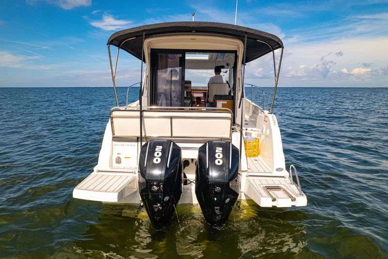  Yacht Photos Pics 2021 Beneteau Antares 9 boat with dual 200 HP engines on open water.