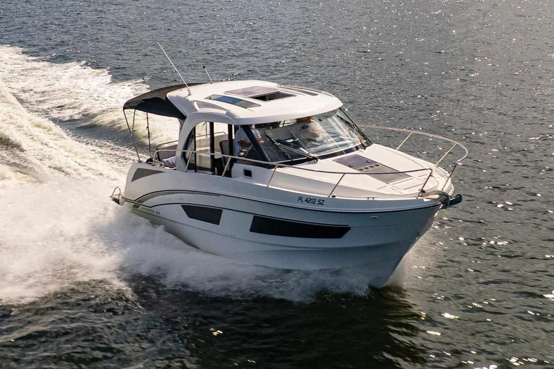  Yacht Photos Pics 2021 Beneteau Antares 9 cruising on open water, showcasing sleek design and performance.