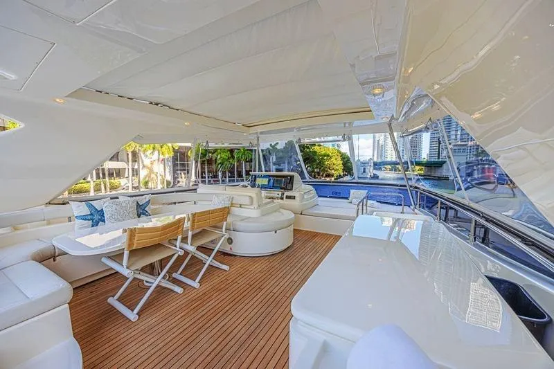 Noral Yacht Photos Pics Luxurious 2011 Ferretti Yachts 830 interior with elegant seating and scenic waterfront view.