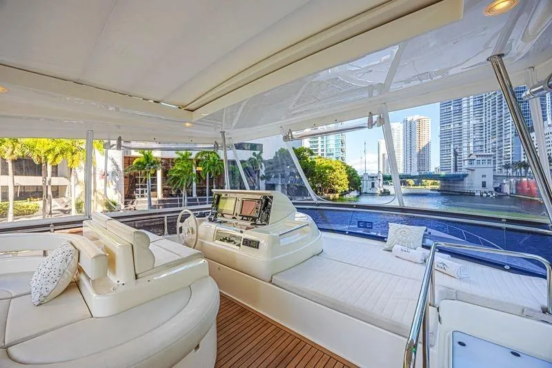 Noral Yacht Photos Pics Luxurious 2011 Ferretti Yachts 830 interior with cityscape view, featuring elegant seating and navigation area.