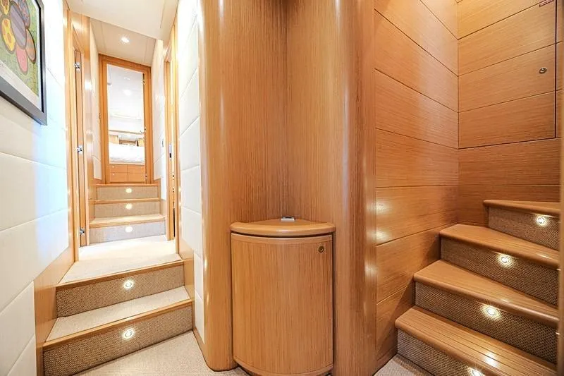Noral Yacht Photos Pics Luxurious interior of 2011 Ferretti Yachts 830 with elegant wooden staircase and hallway.