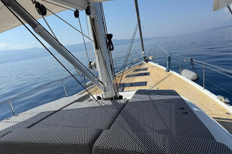  Yacht Photos Pics 2016 Jeanneau 64 sailboat deck with calm sea and clear sky.