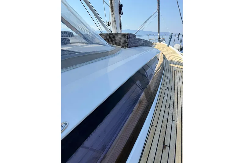  Yacht Photos Pics 2016 Jeanneau 64 yacht deck with sleek design and wooden finish.