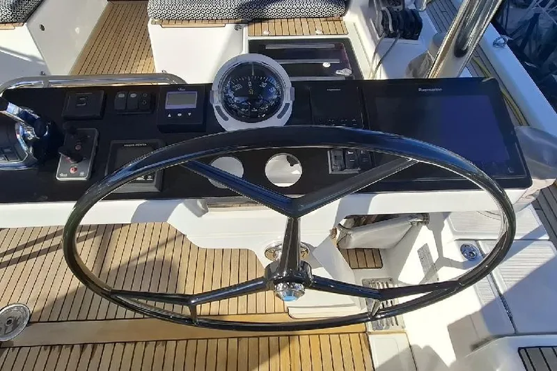  Yacht Photos Pics Steering wheel and controls of a 2016 Jeanneau 64 yacht cockpit.