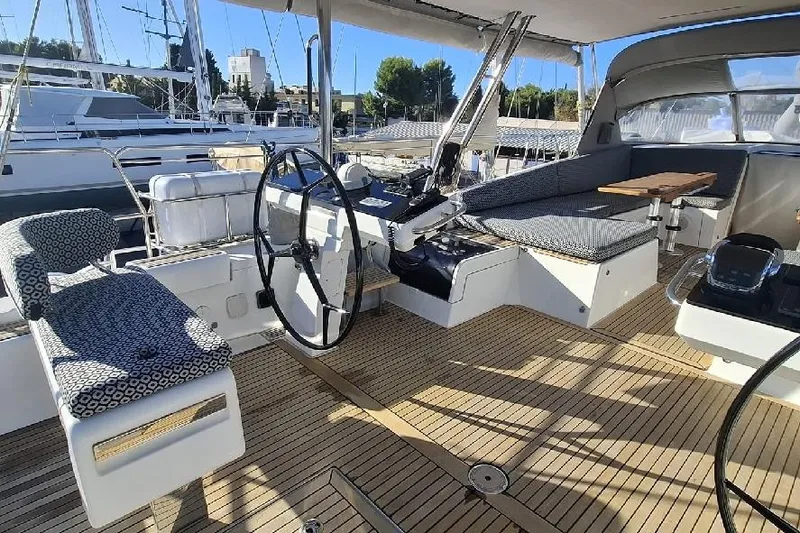  Yacht Photos Pics Luxurious 2016 Jeanneau 64 yacht cockpit with elegant seating and steering wheel.