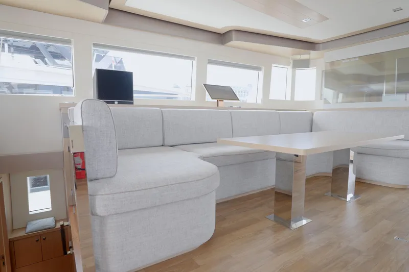  Yacht Photos Pics Luxurious interior of 2025 Mazarin 55 Catamaran with modern seating and sleek design.