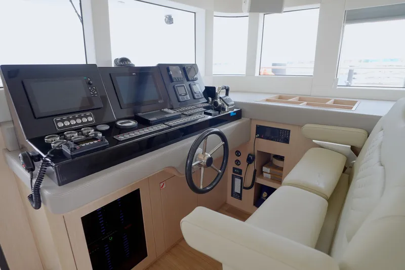  Yacht Photos Pics 2025 Mazarin 55 Catamaran diesel helm with advanced navigation systems and luxurious seating.