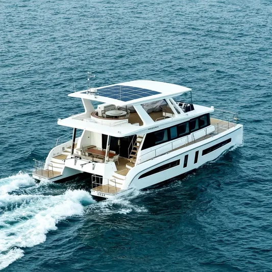  Yacht Photos Pics Luxurious 2025 Mazarin 55 EVO II yacht cruising on open sea.
